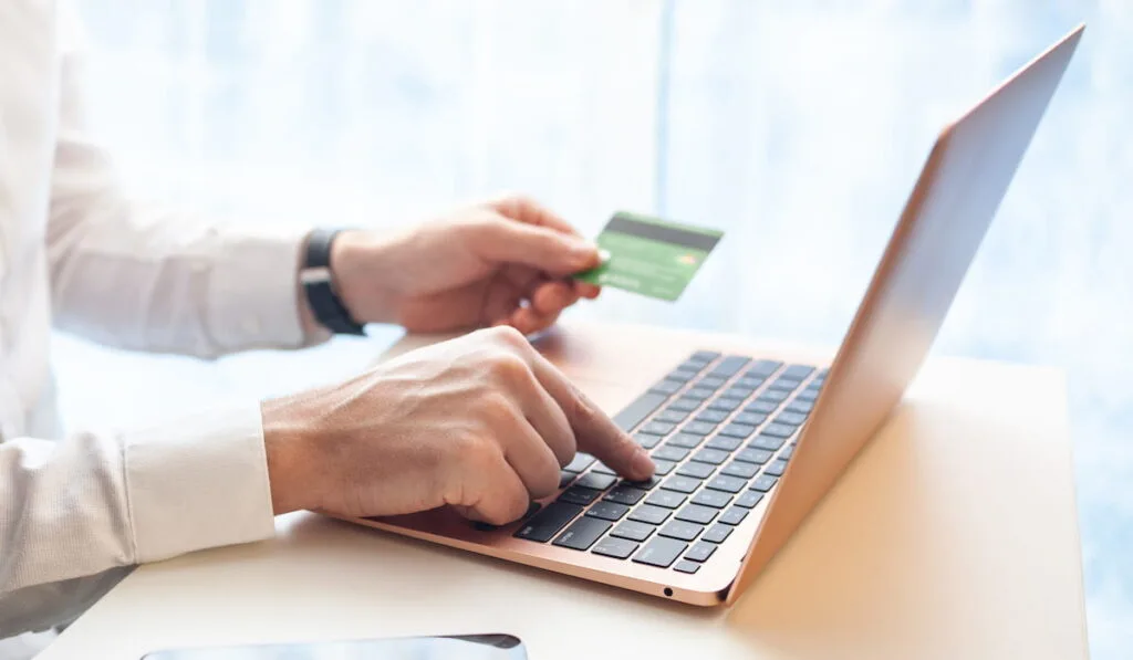 office worker checks his email for online paying 