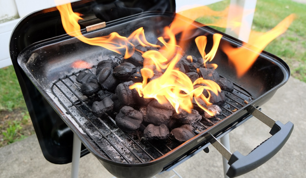 Charcoal briquettes firing up for the grill
