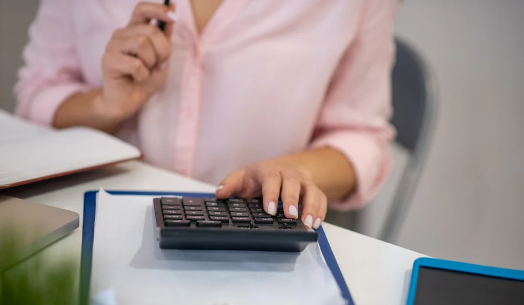 Close up of a calculator being in use
