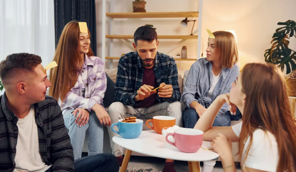 Group of friends have party indoors together