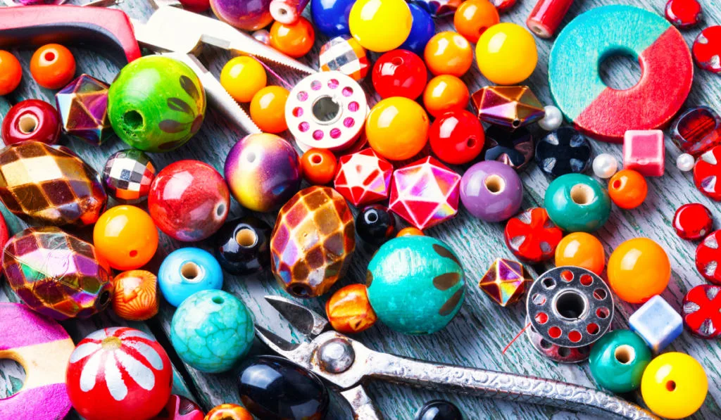 beads and some tools for jewelry making

