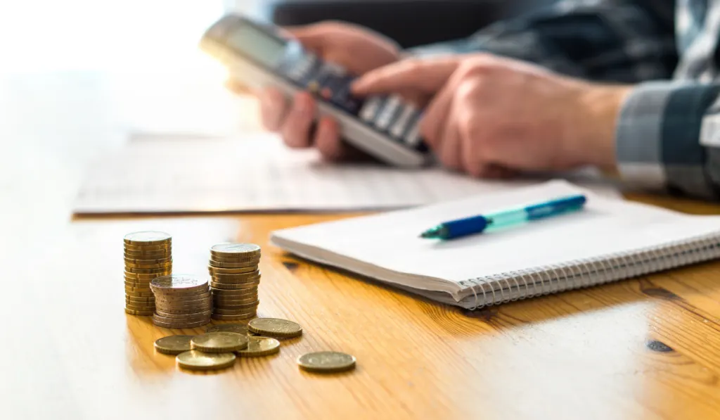 man planning family finance using calculator