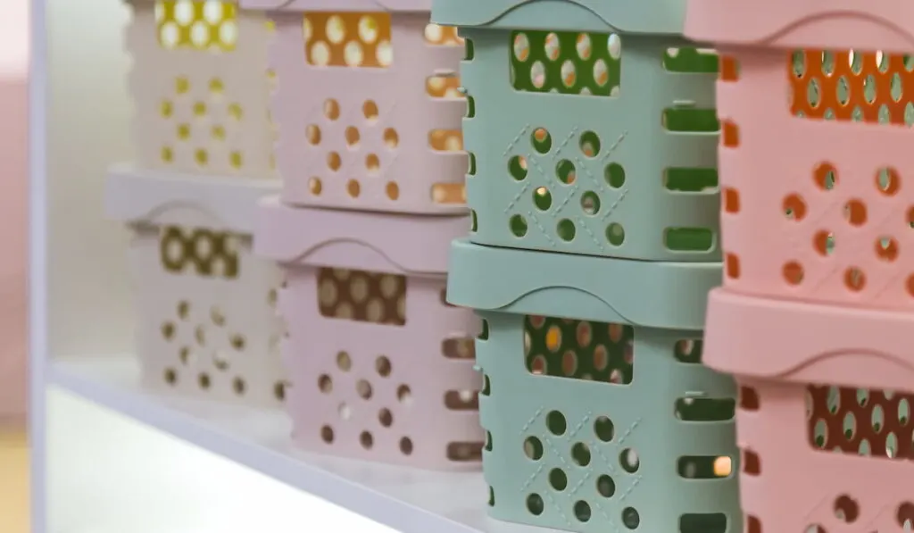 colorful plastic boxes and containers on the shelf