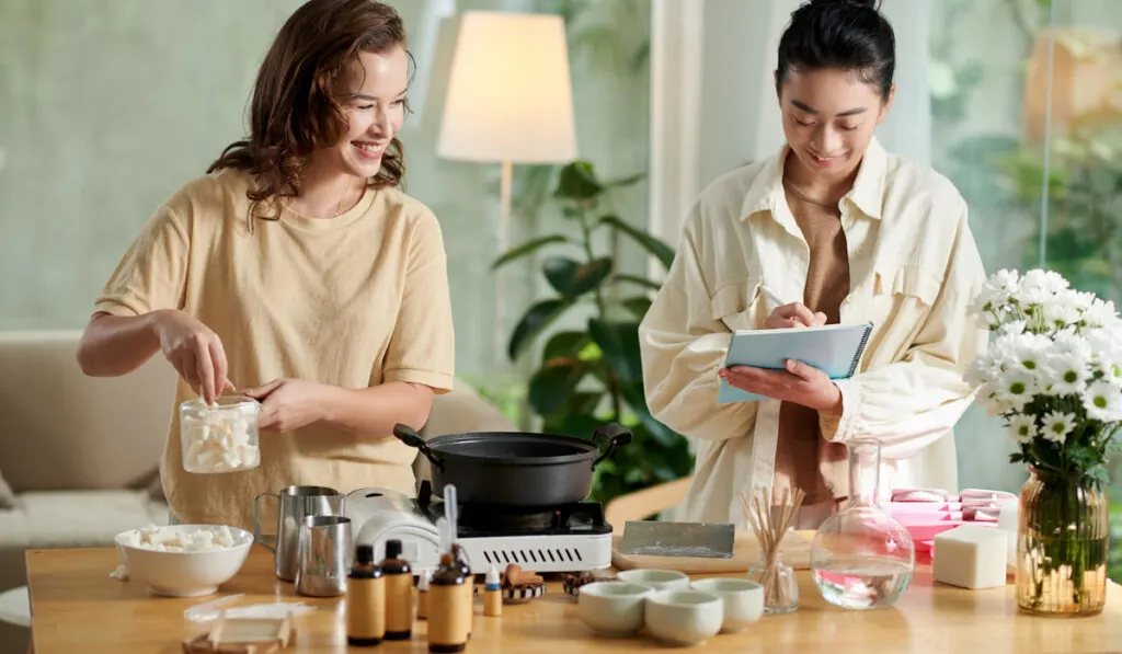 Young women making soap bars at home