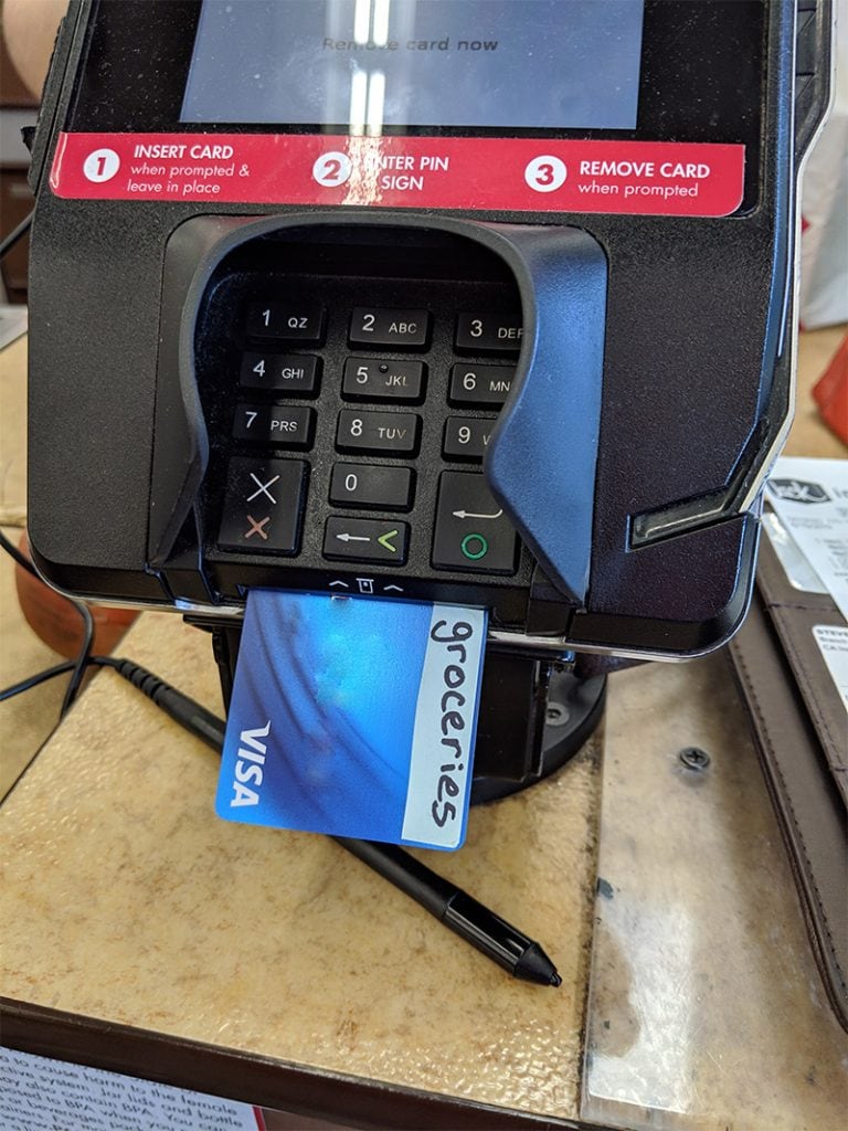 Credit Card Labelled Groceries in a card machine 