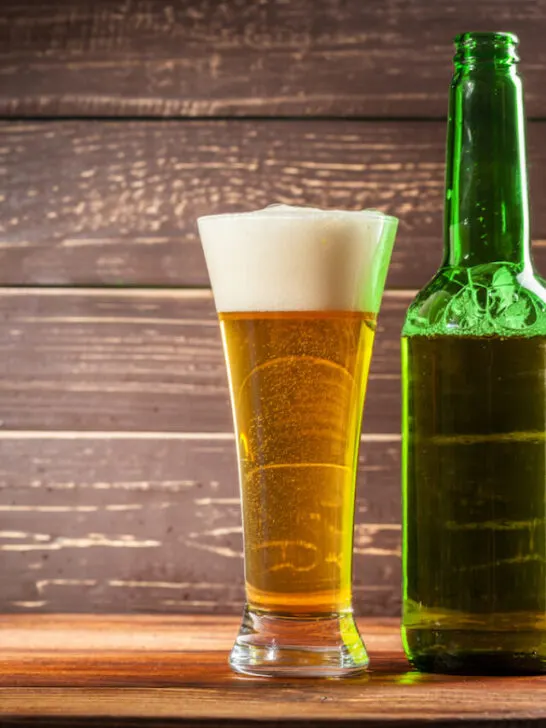 beer in glass and green bottle