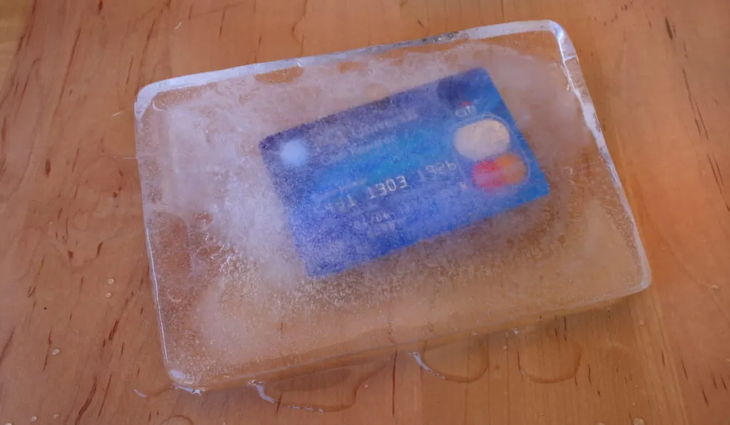 frozen credit card in a block of ice
